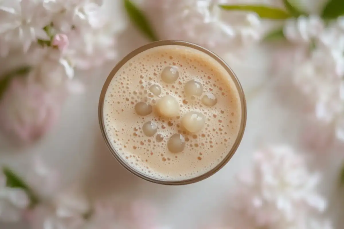 Is jasmine milk tea boba? in a clear cup with chewy tapioca pearls