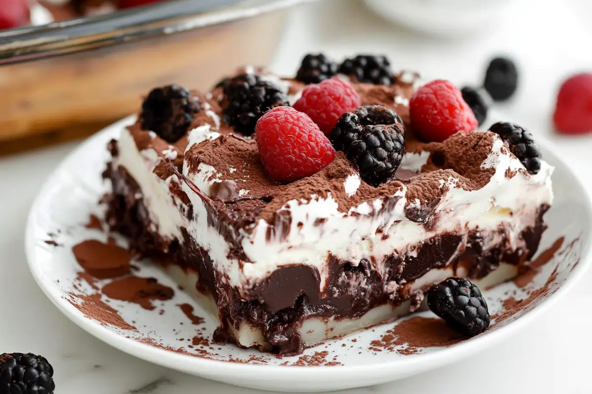 Chocolate dessert lasagna with creamy layers in a glass dish